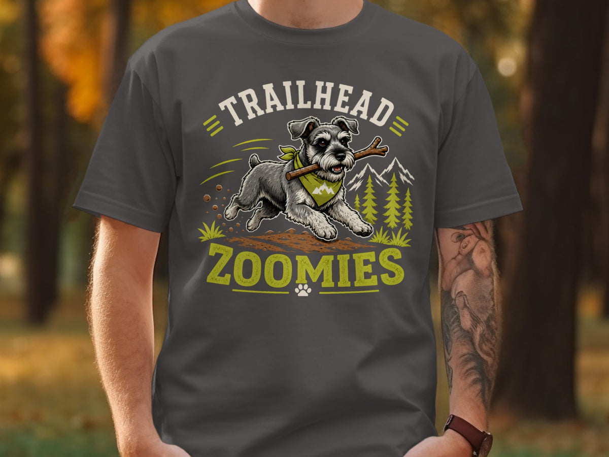T-shirt graphic of a schnauzer running with a stick and text "TRAILHEAD ZOOMIES".