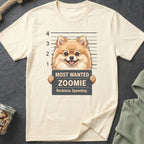 Cream t-shirt with a Pomeranian dog mugshot and "Most Wanted Zoomie" text.