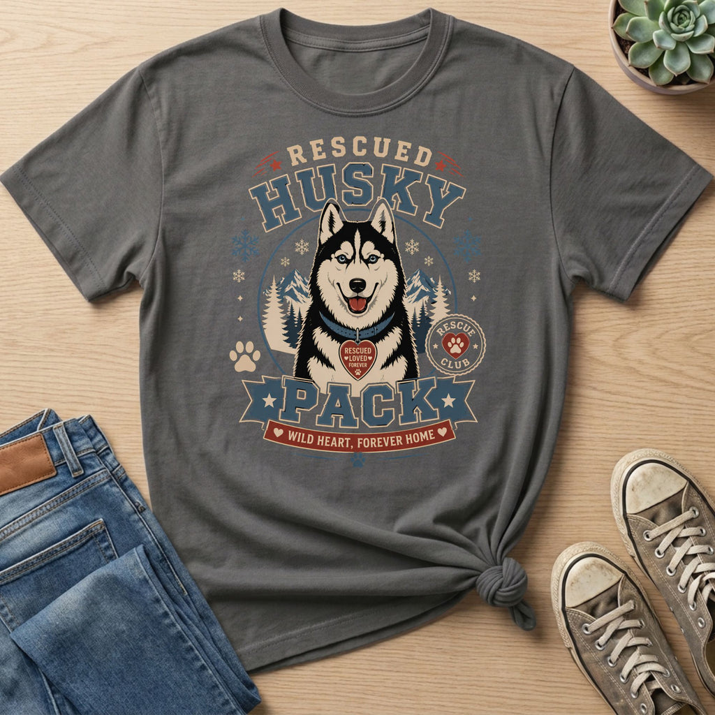 T-shirt graphic with rescued husky, snowflakes, mountains, and text "Rescue Husky Pack."