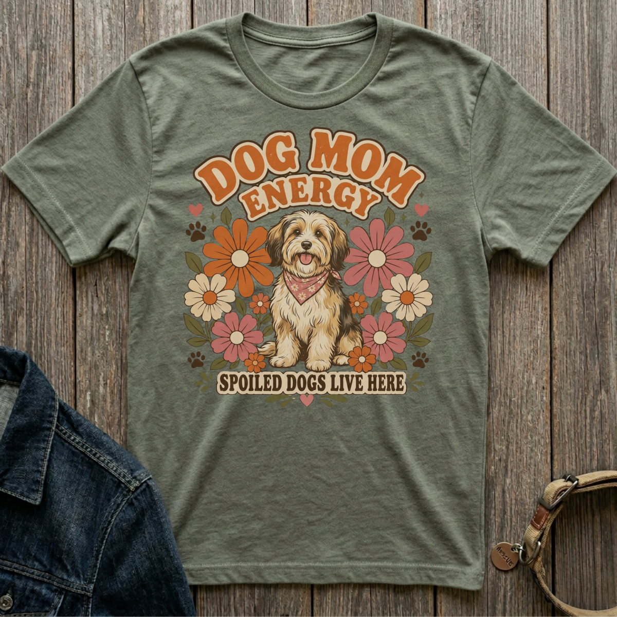Green t-shirt with dog mom energy text and a dog surrounded by flowers.