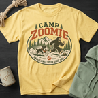Yellow t-shirt with "Camp Zoomie Unexplained Speed Since 1987" graphic.