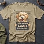 Tan t-shirt with a cartoon dog mugshot, text "Most Wanted Zoomie".
