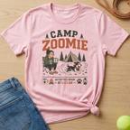 Pink t-shirt with "Camp Zoomie" graphic, dog parent, and activities begin at 5:43 AM.