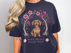 Dachshund under a cherry blossom arch with text "Soft Heart Loyal Soul".