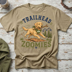 Golden retriever running with stick on shirt with text "TRAILHEAD ZOOMIES."