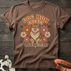 Brown t-shirt with "Dog Mom Energy" and a smiling dog among flowers.