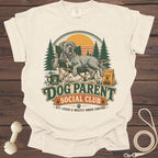 Dog Parent Social Club t-shirt with dog lounging in a chair.
