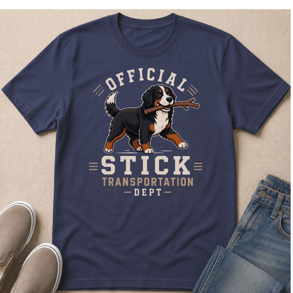 Bernese Mountain Dog with stick on shirt reading "Official Stick Transportation Dept."