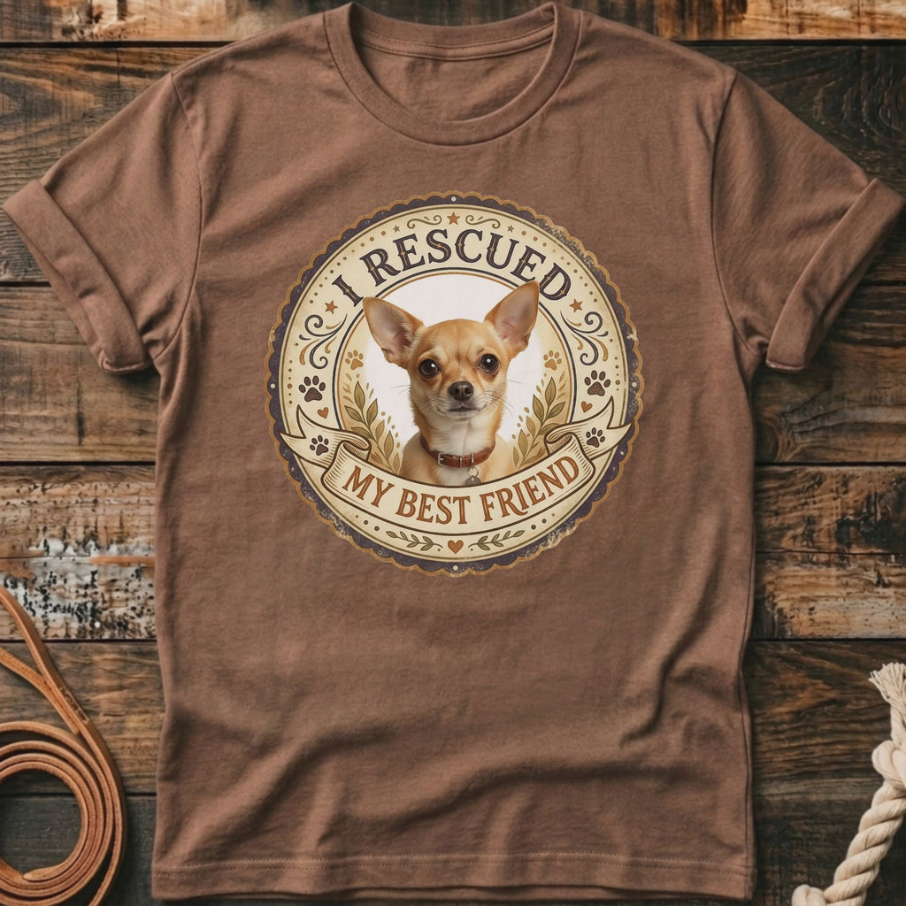 Brown t-shirt with a round graphic of a Chihuahua wearing a collar, text "I RESCUED" and "MY BEST FRIEND".
