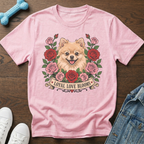 Pink t-shirt with a Pomeranian dog surrounded by roses and the text "Loyal Love Blooms".