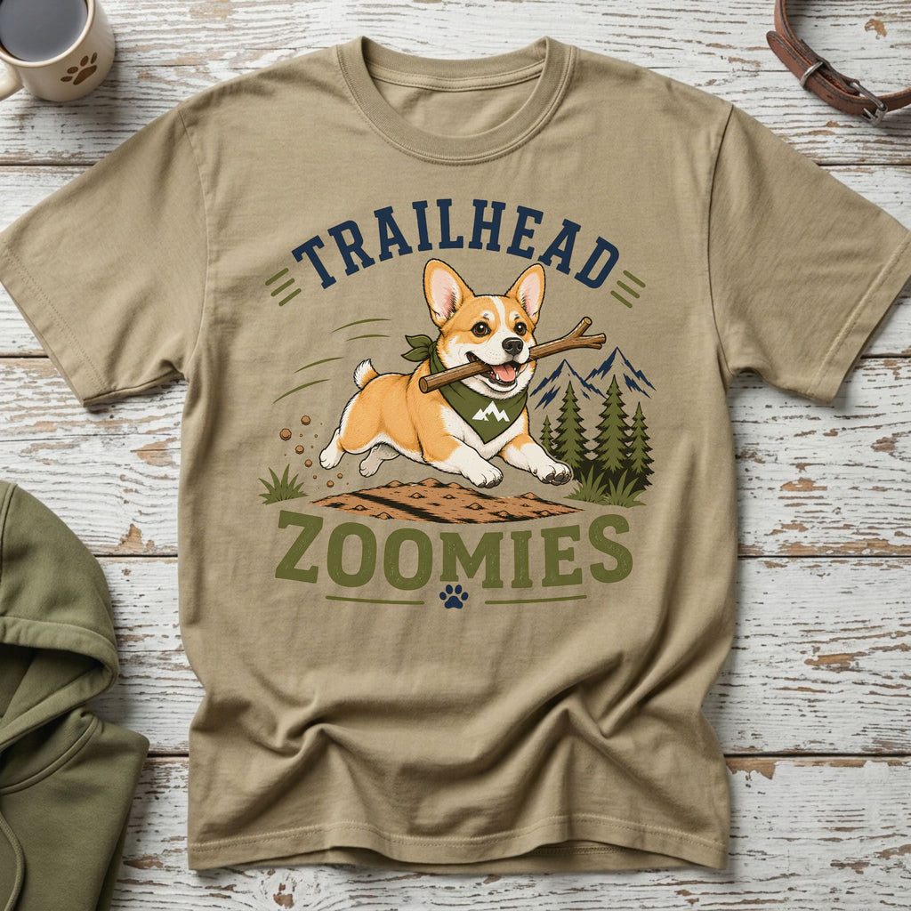 Tan t-shirt with a corgi running with a stick, text "TRAILHEAD ZOOMIES".