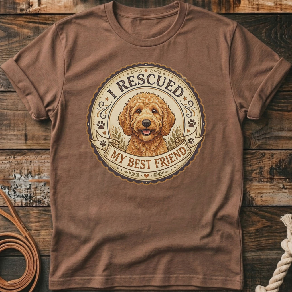Brown t-shirt with a circular graphic featuring a Goldendoodle dog and text "I Rescued My Best Friend".
