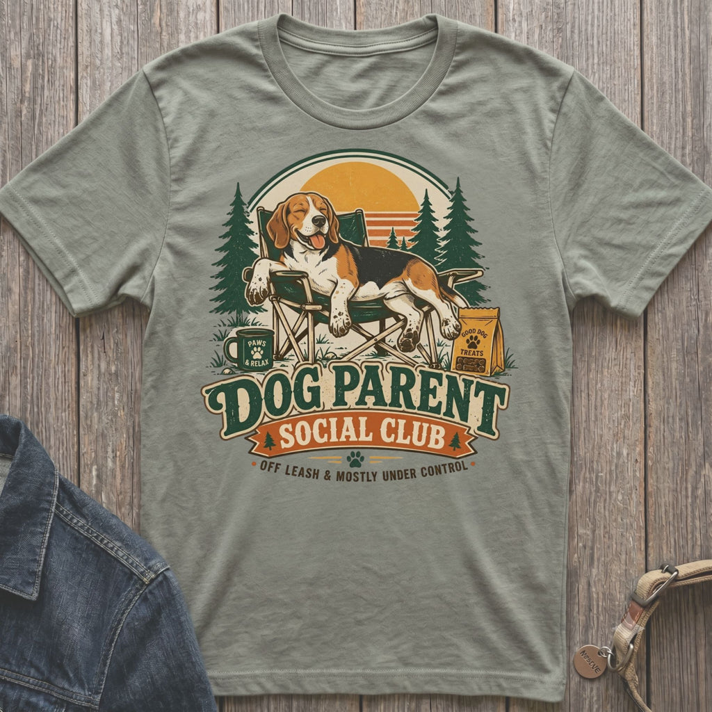 Beagle on camping chair with "Dog Parent Social Club" text and camping scene.