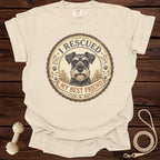 Cream t-shirt with a schnauzer graphic reading "I Rescued My Best Friend".