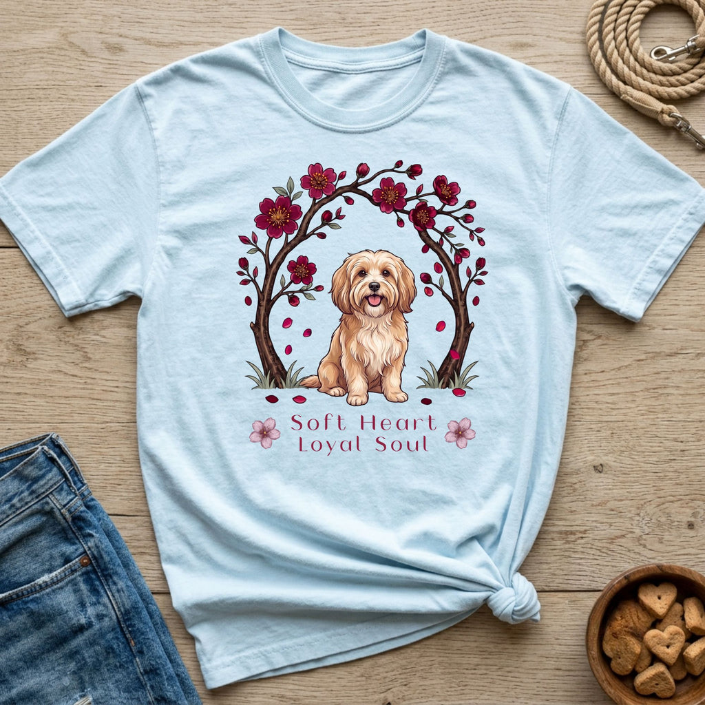 Light blue t-shirt with a doodle of a dog under cherry blossoms and text "Soft Heart Loyal Soul".
