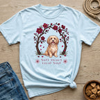 Light blue t-shirt with a doodle of a dog under cherry blossoms and text "Soft Heart Loyal Soul".