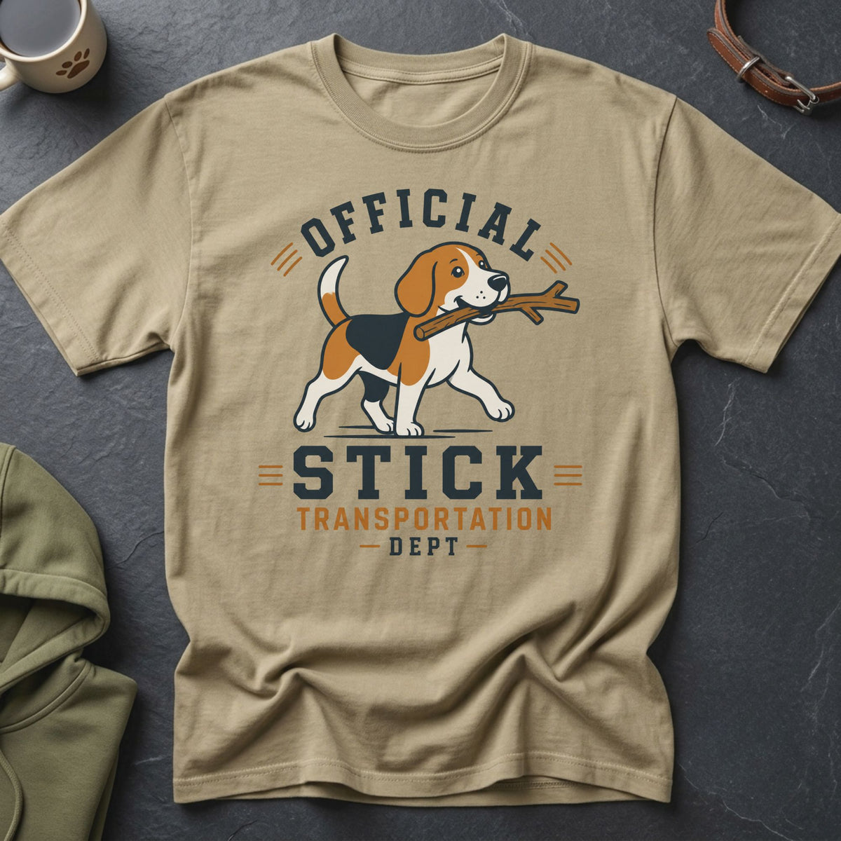 Beagle on khaki t-shirt with "Official Stick Transportation Dept" text.