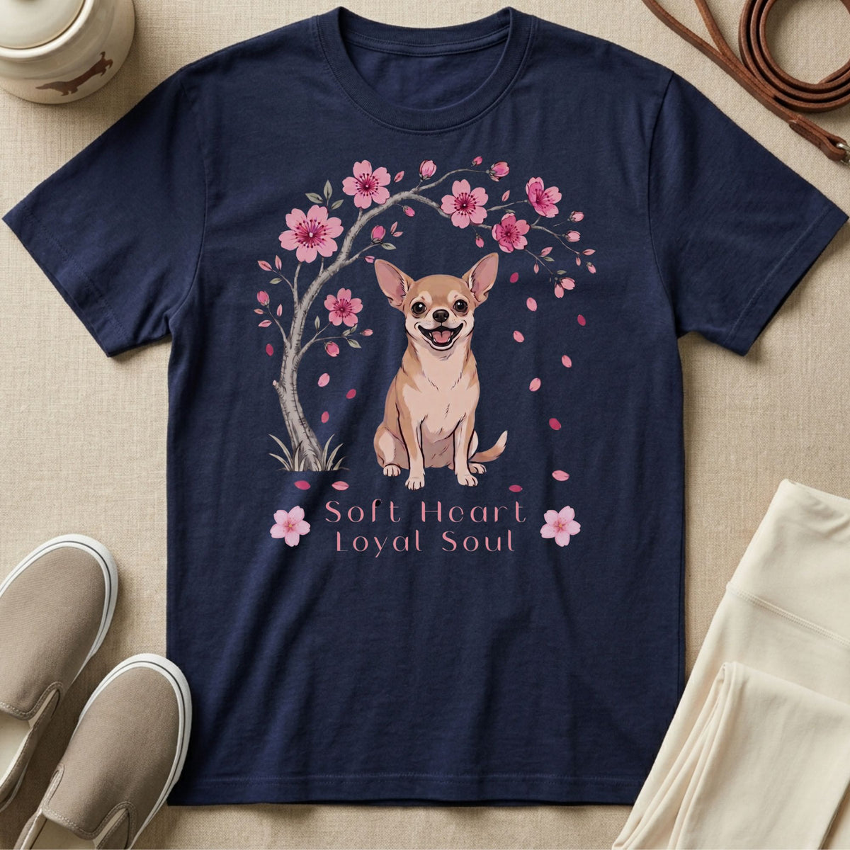 Navy t-shirt with a chihuahua sitting under a cherry blossom tree with text "Soft Heart Loyal Soul".