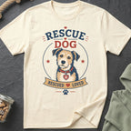 Cream t-shirt with a graphic of a scruffy dog, text "RESCUE DOG" and "RESCUED LOVED".