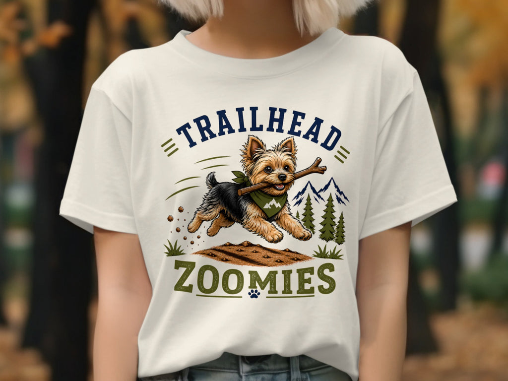 T-shirt graphic of Yorkshire Terrier running with stick, text "TRAILHEAD ZOOMIES".