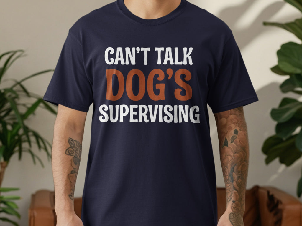 Dark blue t-shirt with text "CAN'T TALK DOG'S SUPERVISING".