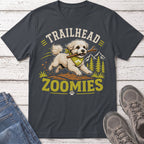 Fluffy dog with stick and bandana, "Trailhead Zoomies" text on a dark gray t-shirt.