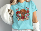 Dachshund surrounded by roses with banner saying "Loyal Love Blooms".