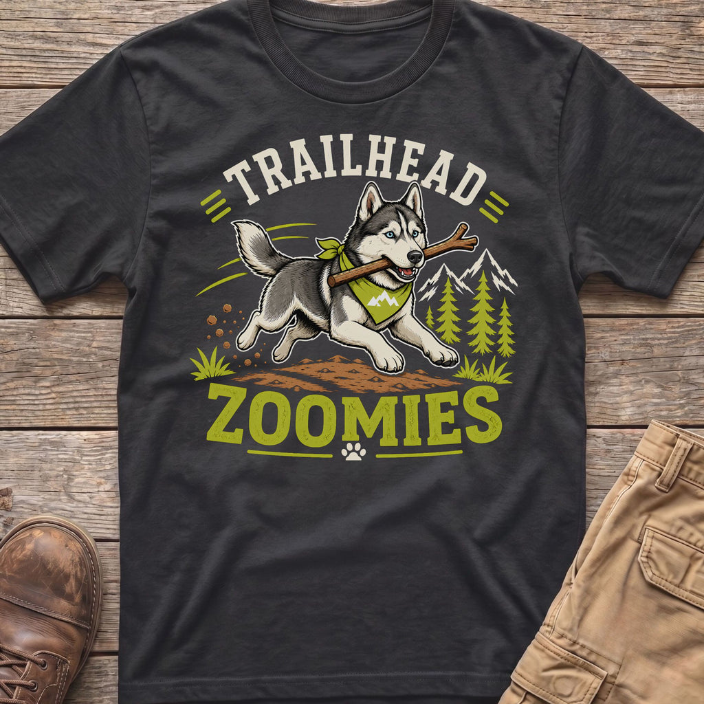 Husky running with stick and bandana text "Trailhead Zoomies" on dark t-shirt.