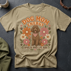 A brown poodle wearing a bandana sits among retro flowers on a tan t-shirt with text.