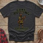 Dark t-shirt with graphic of a Doberman holding a rifle and "Gone Hunting Dog House Hunt Club".