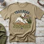 White dog with stick and bandana, text "TRAILHEAD ZOOMIES" and mountains.