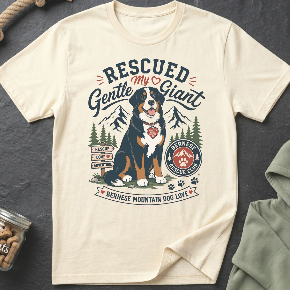 Bernese Mountain Dog wearing "Adopted Loved Forever" tag. Text: Rescued Gentle Giant.