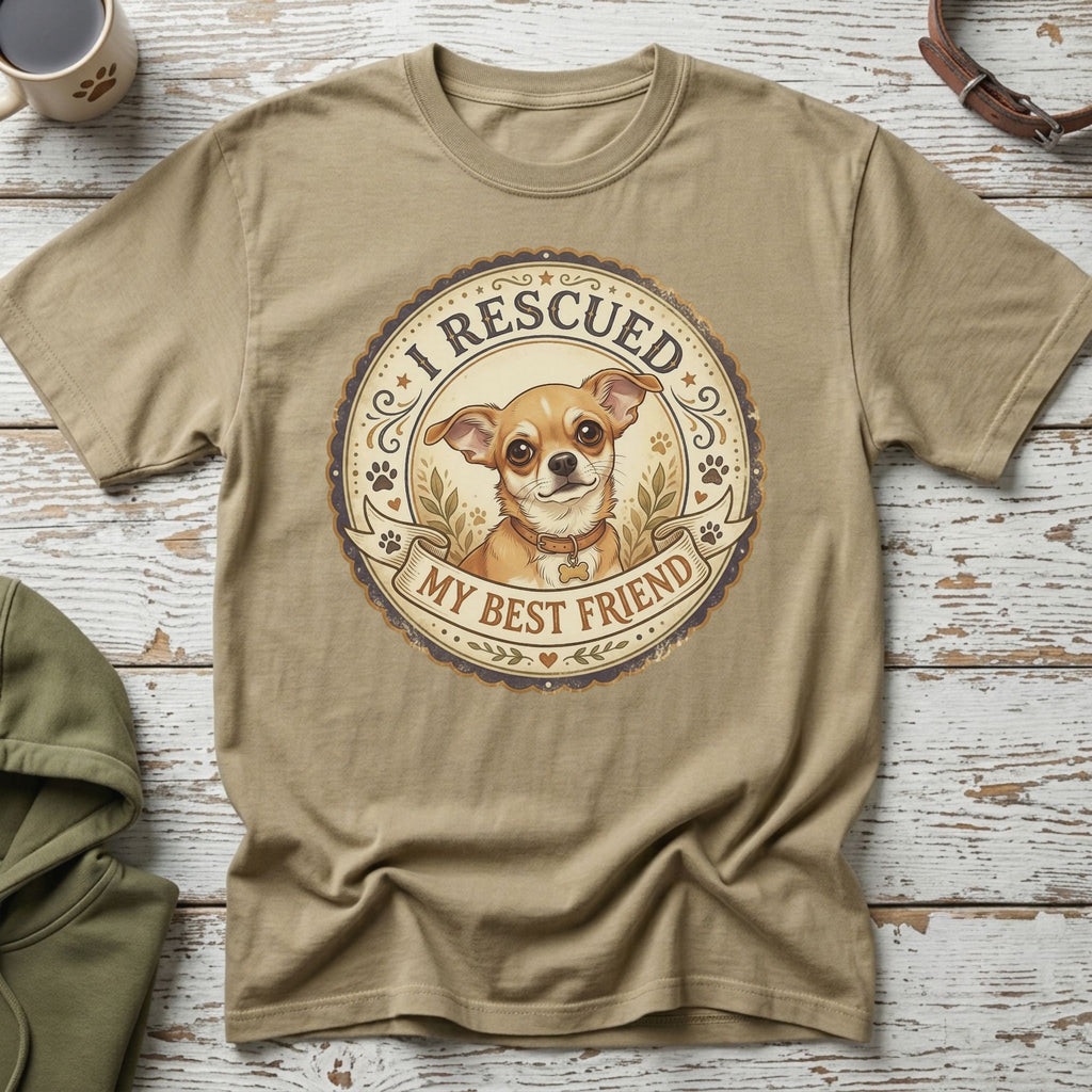 Tan t-shirt with graphic of a chihuahua dog and text "I Rescued My Best Friend".