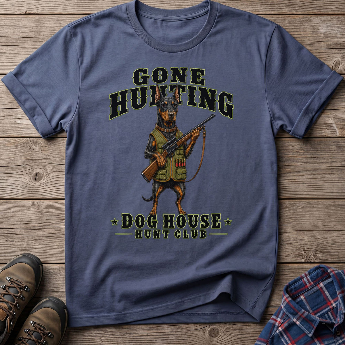 Doberman wearing hunting vest, holding rifle, with "Gone Hunting Dog House Hunt Club" text.