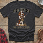 T-shirt graphic of a Cavalier King Charles Spaniel with a shotgun, "Gone Hunting" and "Dog House Hunt Club" text.