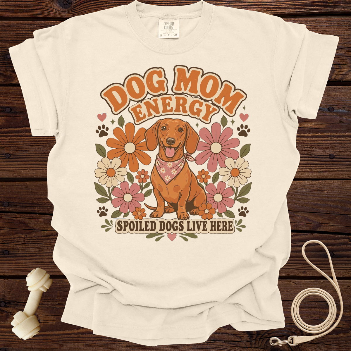 Dachshund with "Dog Mom Energy" and "Spoiled Dogs Live Here" text on cream t-shirt.