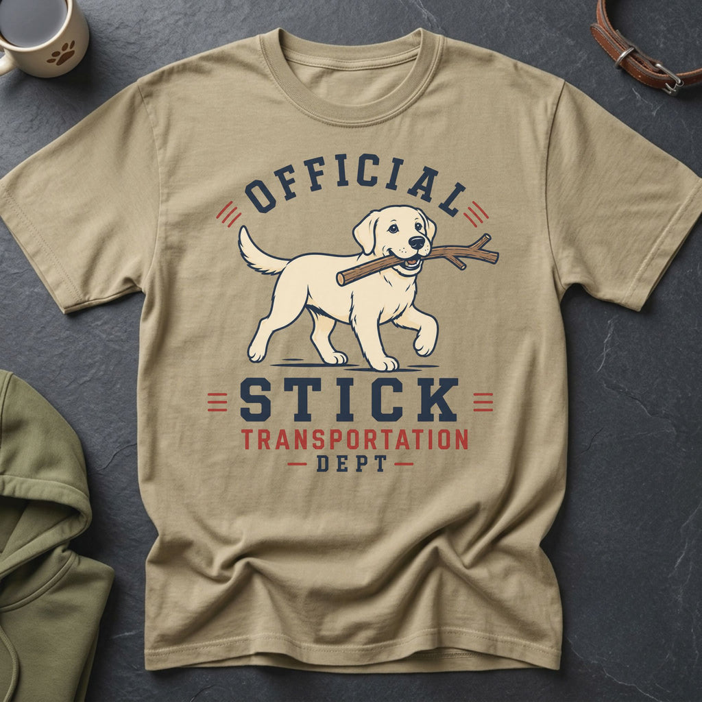 Tan t-shirt with a Labrador carrying a stick and text that reads "Official Stick Transportation Dept".