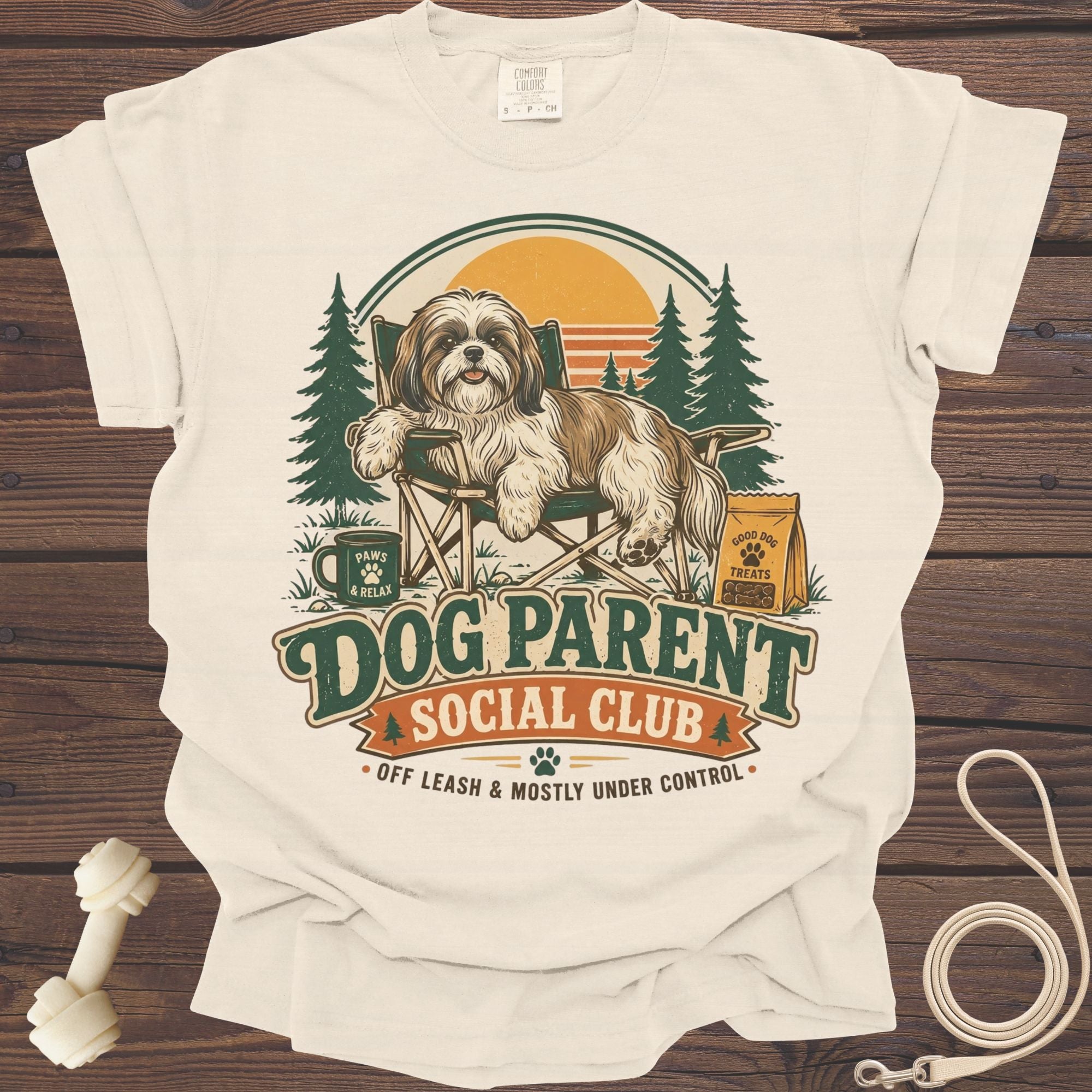 T-shirt graphic with a Shih Tzu dog on a camping chair. Text reads "Dog Parent Social Club".