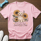 Pink t-shirt with a dog and sunflowers graphic that reads "You Are My Sunshine Pup".