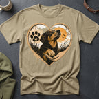 Dog in a heart shape with paw print and sunset, on a tan t-shirt.