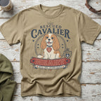 T-shirt with a Cavalier King Charles Spaniel graphic, text "Rescued Cavalier Heart".