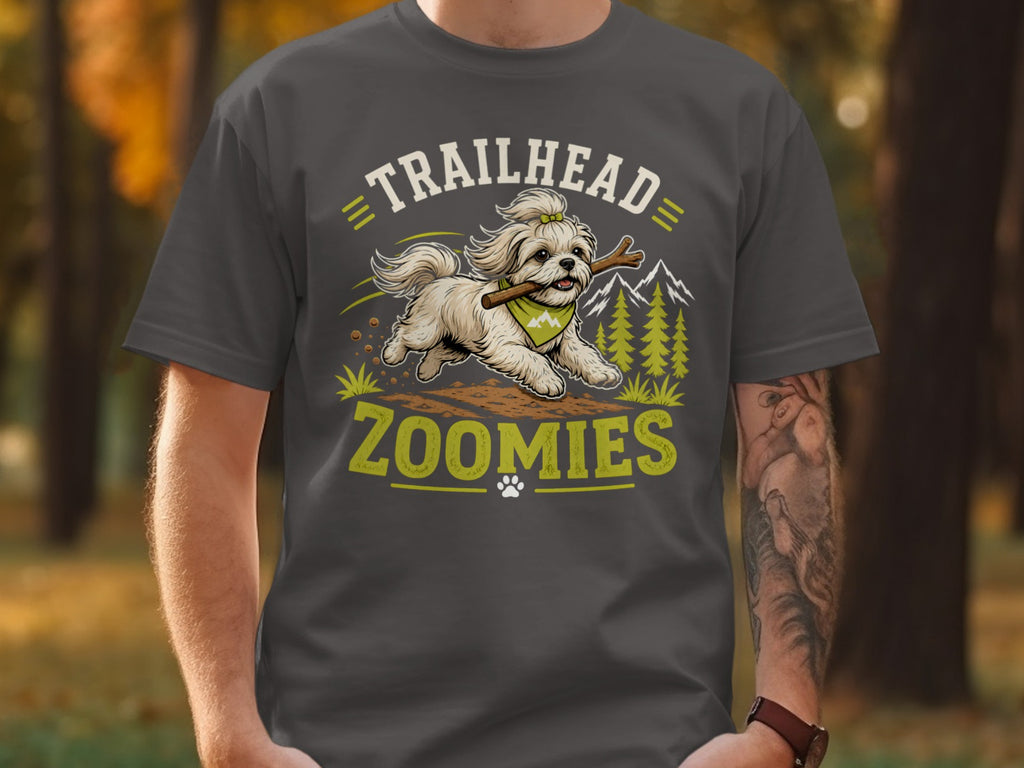 T-shirt graphic: Shih Tzu running with stick, "TRAILHEAD ZOOMIES" text, mountains, trees.