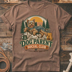 Yorkshire terrier relaxing in a chair with "Dog Parent Social Club" text.