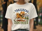 Pomeranian dog running with stick, text "TRAILHEAD ZOOMIES" and mountains.