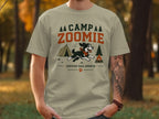 T-shirt with "CAMP ZOOMIE CERTIFIED TRAIL SPRINTER" text and cartoon dog graphic.