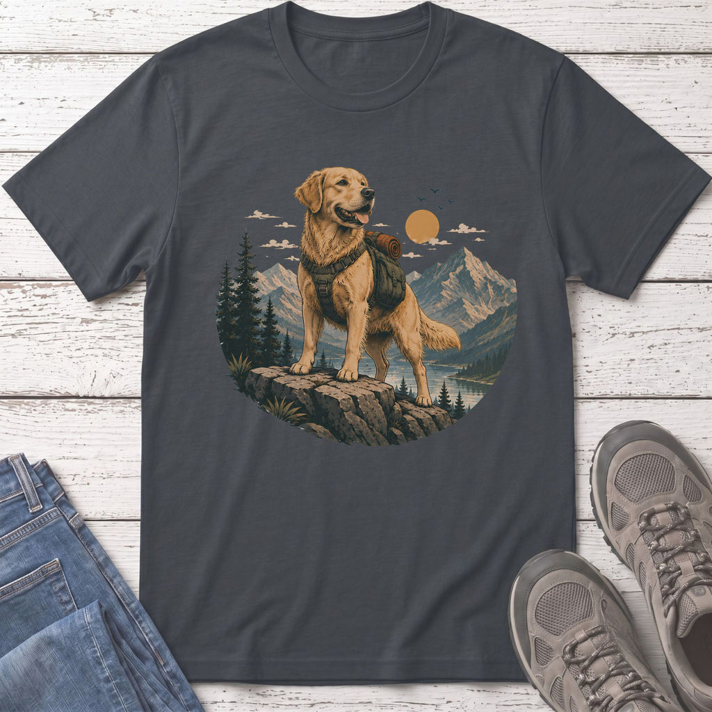 Golden retriever with backpack stands on rock in mountain landscape.