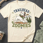 White bulldog with stick and bandana, text "TRAILHEAD ZOOMIES"
