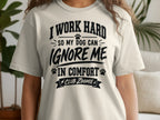 Cream t-shirt with black text: I Work Hard So My Dog Can Ignore Me In Comfort Club Zoomie.