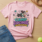 Pink t-shirt with cartoon dog graphic that says "CAMP ZOOMIE OUTDOOR CHAOS PROGRAM".
