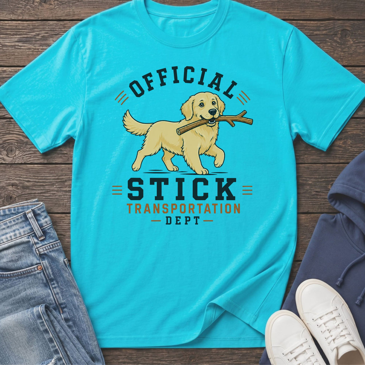 Turquoise t-shirt with a Golden Retriever carrying a stick and text "Official Stick Transportation Dept."